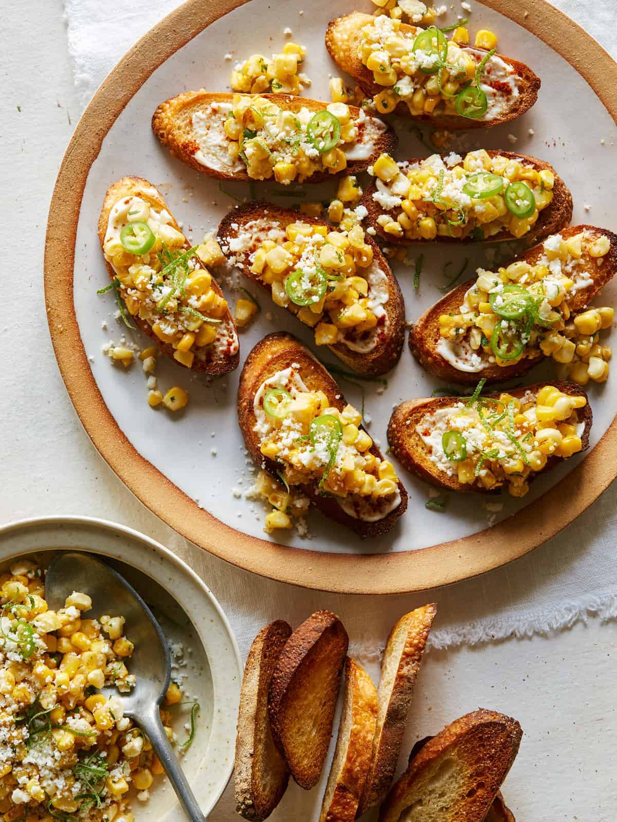 https://www.spoonforkbacon.com/wp-content/uploads/2017/05/Elote_Bruschetta.jpg