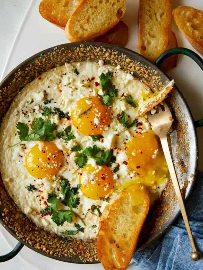 Simple Herb Baked Eggs with Crumbled Cheese - Spoon Fork Bacon