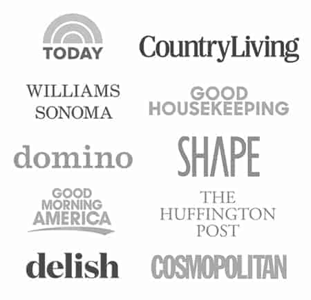 A complication of logos showcasing where Spoon Fork Bacon has been featured. Including delish, today show, cosmopolitan, good morning america, domino, good housekeeping, william sonoma, and country living.