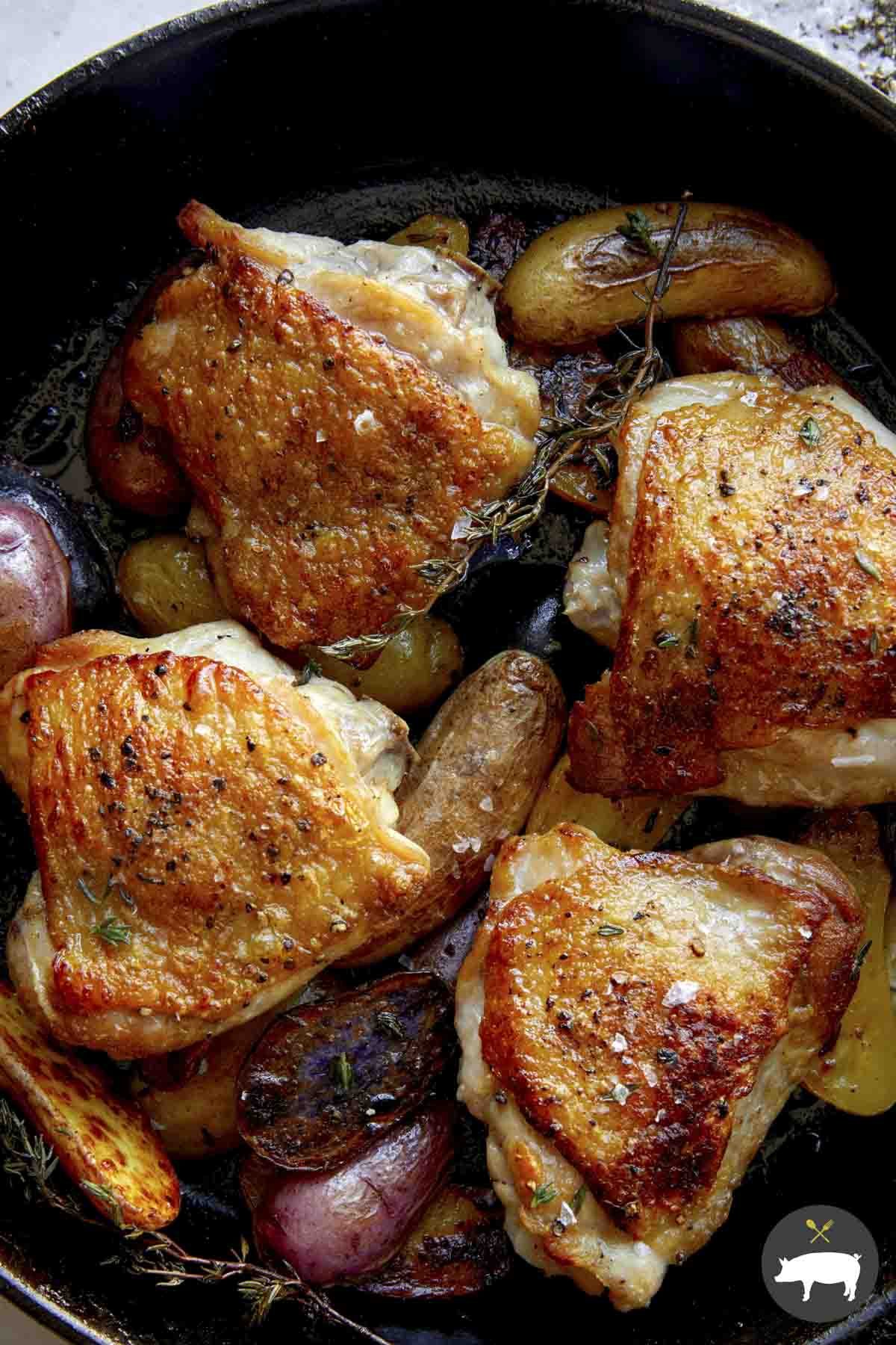 Crispy chicken thigh recipe in a skillet.