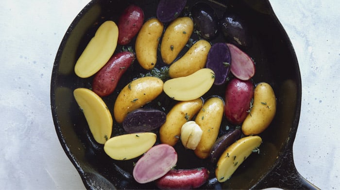 Fingerling potatoes in a skillet.