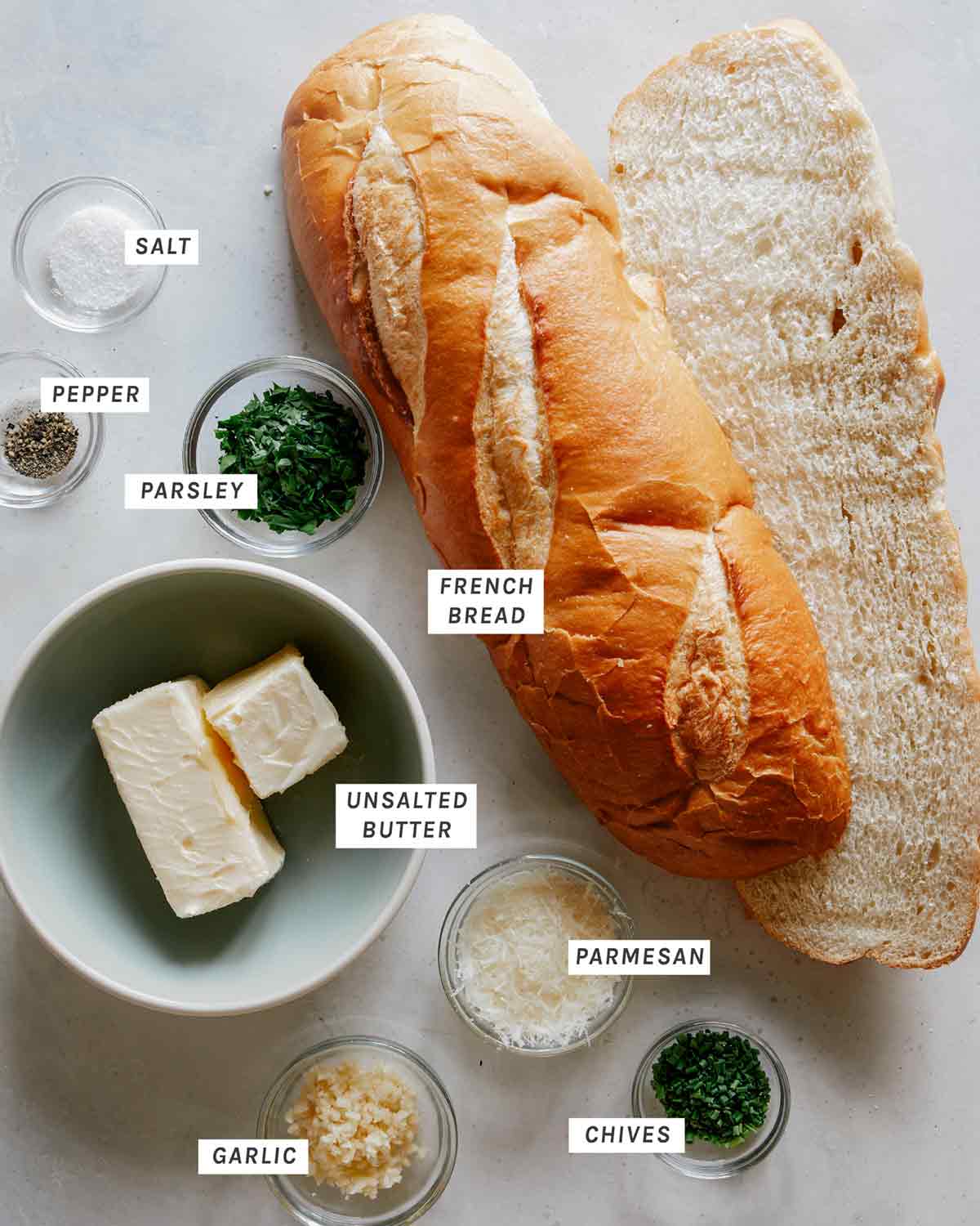 Ingredients to make garlic bread all laid out. 