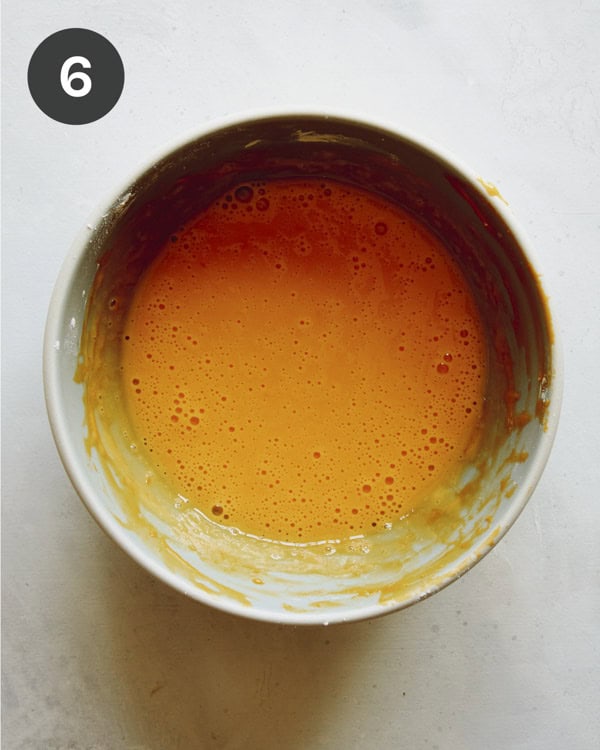 Egg yolks in a bowl to make pudding. 