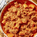 Romesco sauce pasta close up in a skillet.