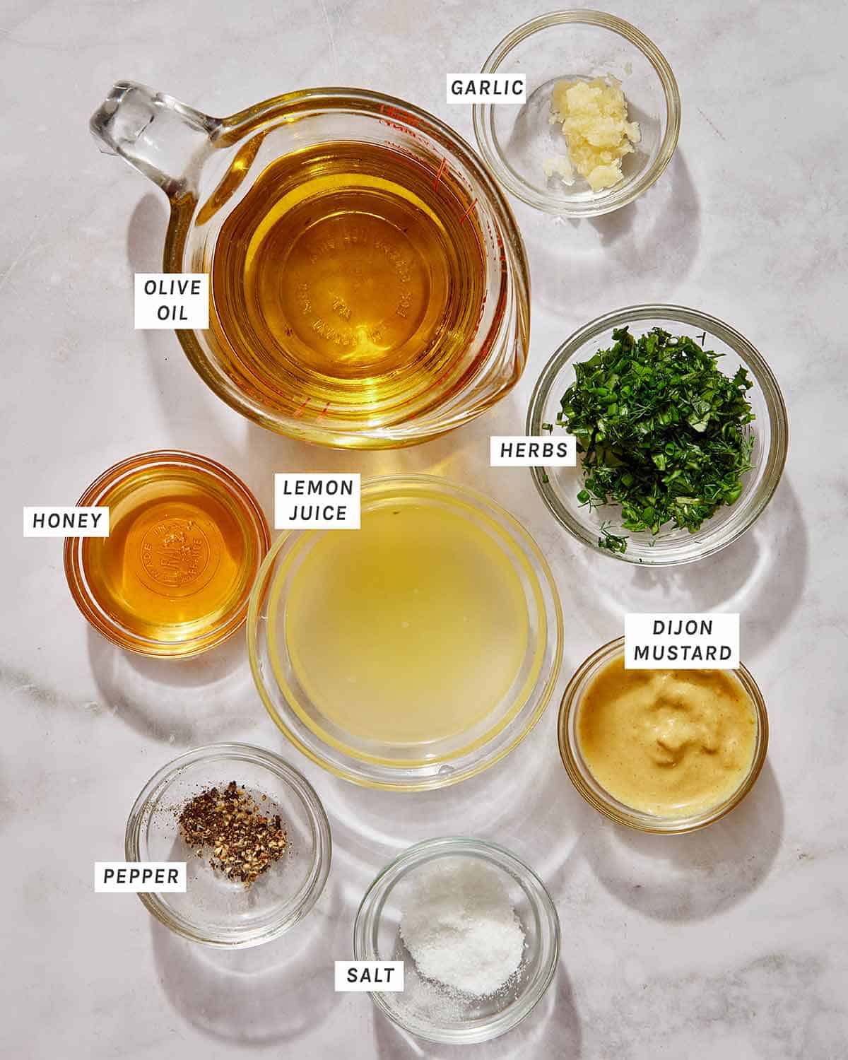 Ingredients for an herb vinaigrette salad dressing. 