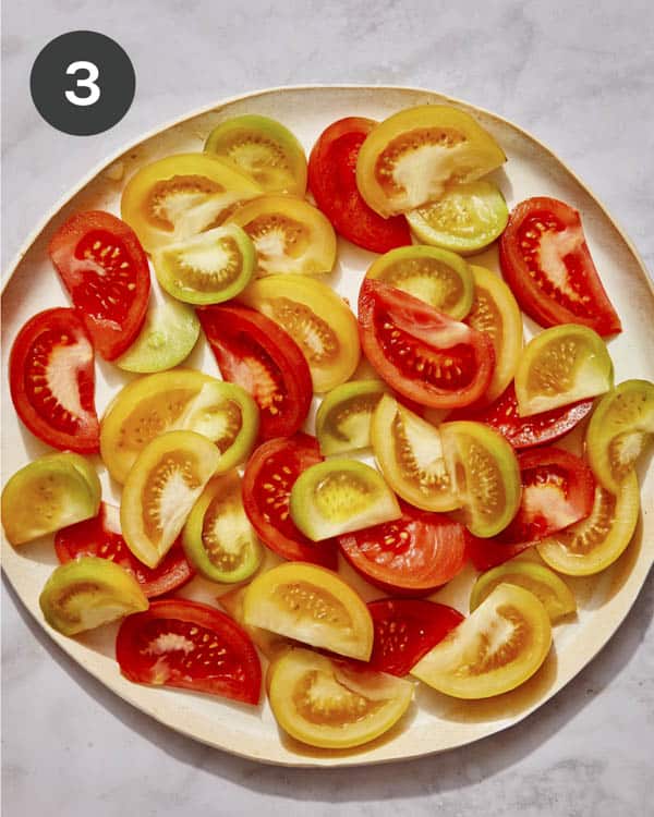 Quartered tomatoes on a plate. 