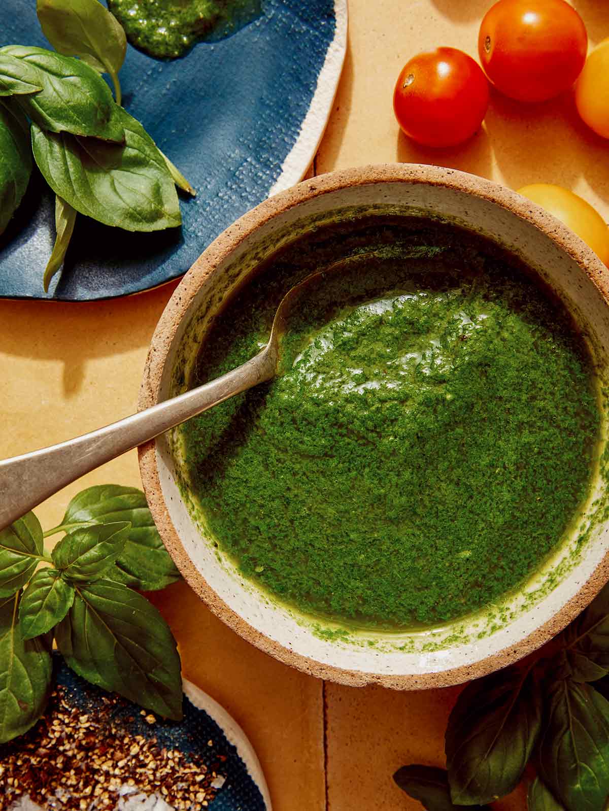 Basil vinaigrette recipe in a bowl ready to be drizzled on a salad.