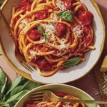 Fresh tomato sauce pasta in bowls ready to be served.