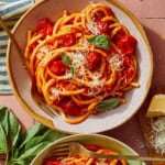 Fresh tomato sauce pasta in bowls ready to be served.