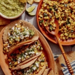 Vegetarian tacos on a platter with the zucchini and corn filling on the side.