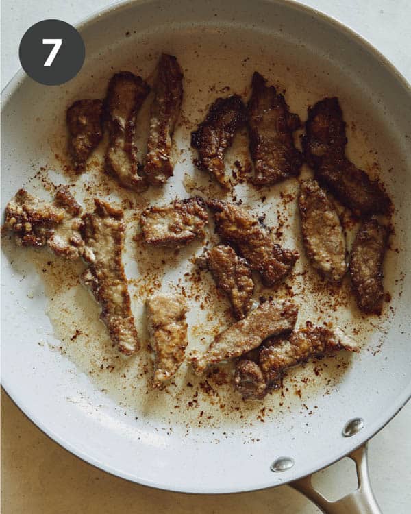 Cooking beef in a skillet. 