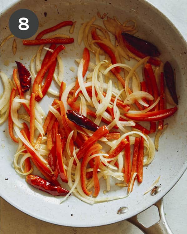 Cooking peppers and chiles in a skillet. 