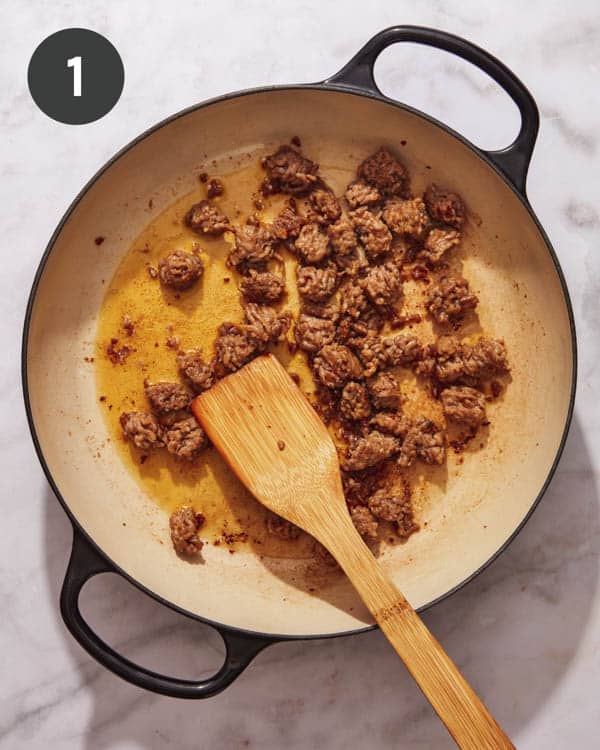 Sausage cooking in a skillet. 