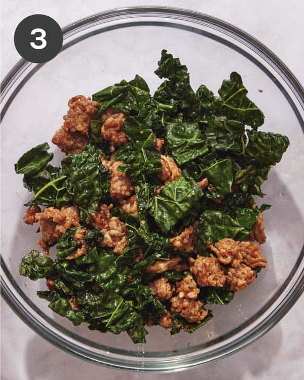 Sausage and kale in a bowl.