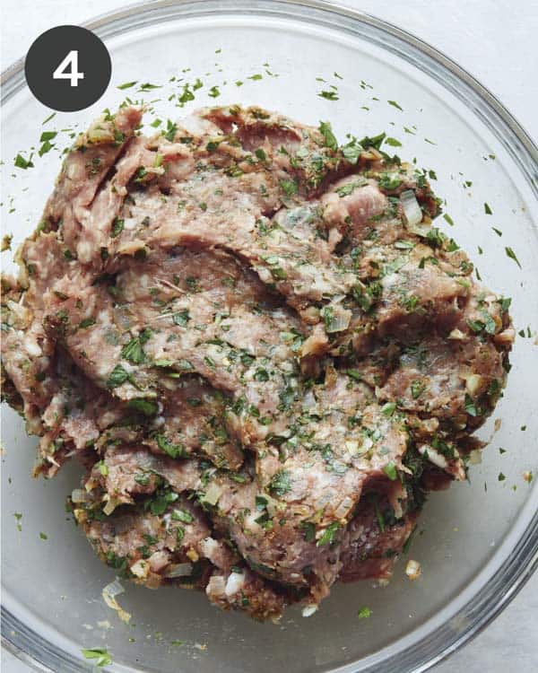 Ground lamb for Lamb Kofta combined in a glass bowl.