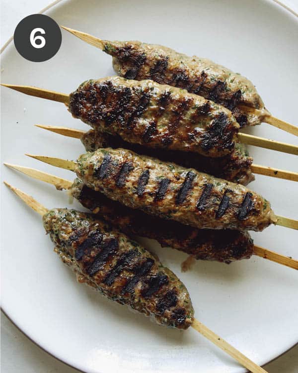 Lamb kofta freshly grilled on a plate.