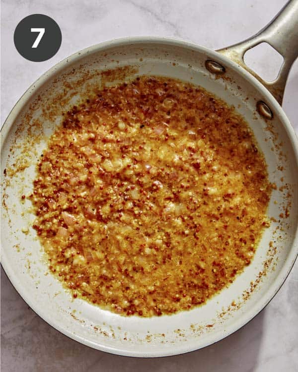 Cream sauce base simmering in a skillet. 