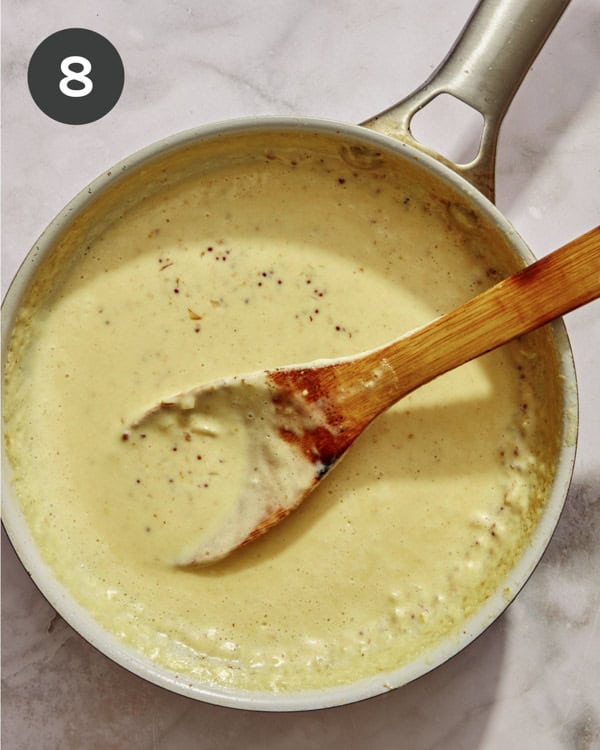 Cream sauce in a skillet simmering. 