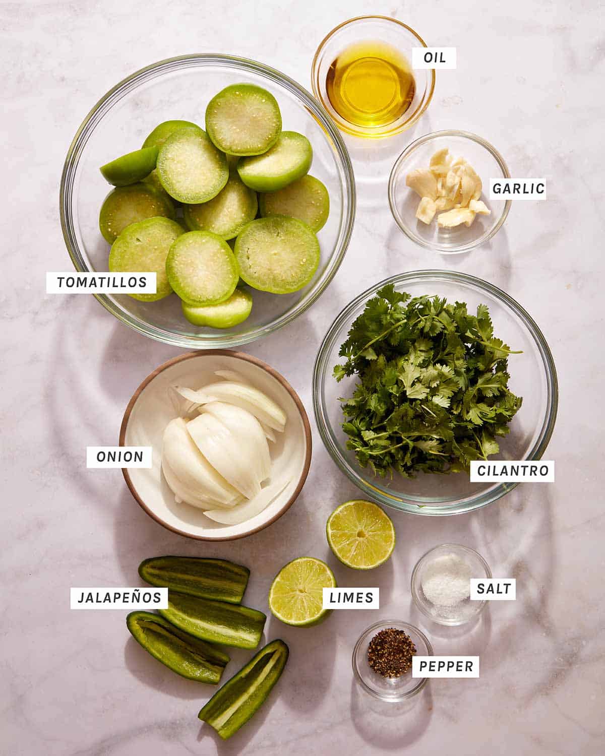 Tomatillo Salsa ingredients on the kitchen counter. 